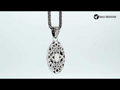 Sterling silver oval pendant with intricate Bali carvings, wholesale artisan jewelry.