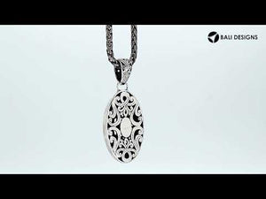 Sterling silver oval pendant with intricate Bali carvings, wholesale artisan jewelry.