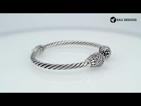 Sterling silver twisted bangle with Balinese carved ends, handcrafted in Bali