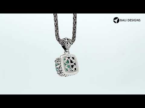 Sterling silver pendant with cushion-cut green chalcedony quartz, handcrafted in Bali with ornate detailing and oxidized finish.