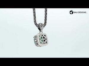 Sterling silver pendant with cushion-cut green chalcedony quartz, handcrafted in Bali with ornate detailing and oxidized finish.