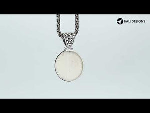 Sterling Silver Bone Face Round Pendant With Ornate Balinese Scrollwork Bail.