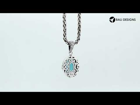 Sterling silver pendant with London Blue Topaz Quartz and rope-accent Balinese oval design.