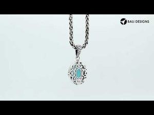 Sterling silver pendant with London Blue Topaz Quartz and rope-accent Balinese oval design.