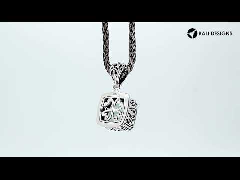 Sterling silver pendant with cushion-cut green amethyst quartz, handcrafted in Bali with bead and scroll detailing.