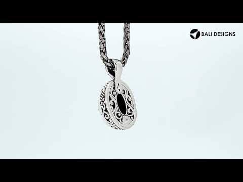 Sterling silver oval pendant featuring faceted Amethyst Quartz with detailed artisan metalwork.