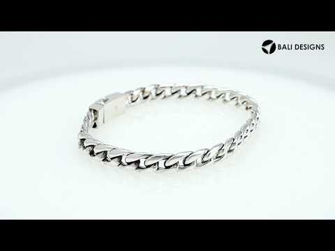 A wholesale sterling silver classic curb bracelet featuring a polished finish and engraved Push Clasp, crafted with refined contemporary styling for premium bulk jewelry selections.