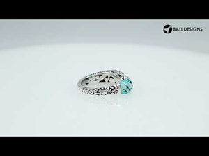 Wholesale sterling silver dragon head ring with faceted Green Quartz , handcrafted Balinese jewelry with intricate carvings and adjustable open band.