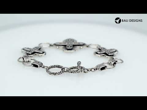 Sterling Silver bracelet featuring multiple cross-shaped links with detailed scroll patterns, polished edges, and a secure toggle lock for wholesale jewelry collections.