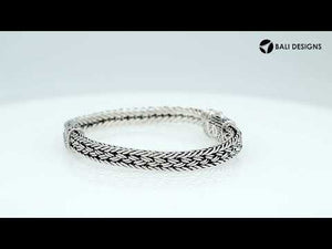 Sterling silver woven chain bracelet featuring ornamental detailing and a secure push clasp, designed for professional jewelry retailers and wholesale distributors.