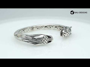 Wholesale sterling silver phoenix bangle featuring Mother of Pearl accents, detailed Balinese scroll carving, and a secure hinge lock ideal for premium artisan jewelry collections.