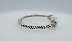 925 Sterling Silver Balinese Twisted Bangle With Shell Pearl And Hinge Lock On White Background