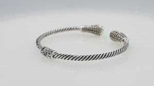 Silver twisted cable bangle in 925 sterling silver with Blue Topaz Quartz ends and Balinese engraving.