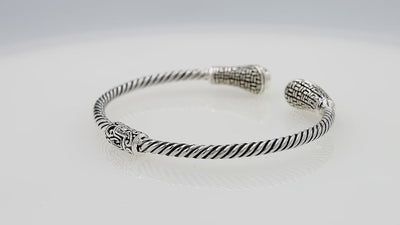 Silver twisted cable bangle in 925 sterling silver with Blue Topaz Quartz ends and Balinese engraving.