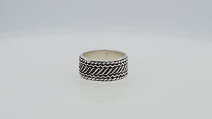 Wholesale sterling silver wide band ring with diagonal braided Bali-inspired design and oxidized details, handcrafted unisex artisan jewelry in bulk for retailers and resellers.
