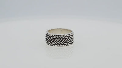 Wholesale sterling silver wide band ring with diagonal braided Bali-inspired design and oxidized details, handcrafted unisex artisan jewelry in bulk for retailers and resellers.