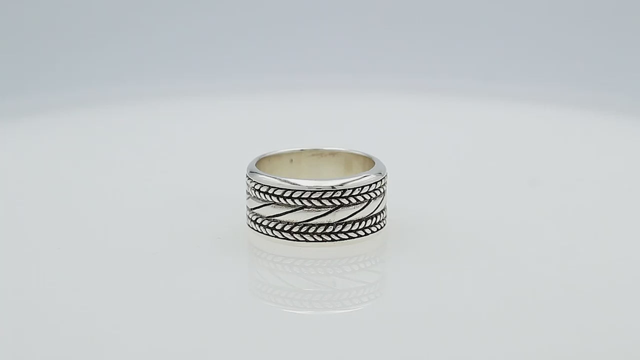 Wholesale sterling silver wide band ring with diagonal rope Bali-inspired design and oxidized details, handcrafted unisex artisan jewelry in bulk for retailers and resellers.