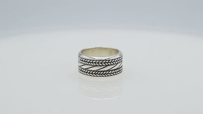 Wholesale sterling silver wide band ring with diagonal rope Bali-inspired design and oxidized details, handcrafted unisex artisan jewelry in bulk for retailers and resellers.