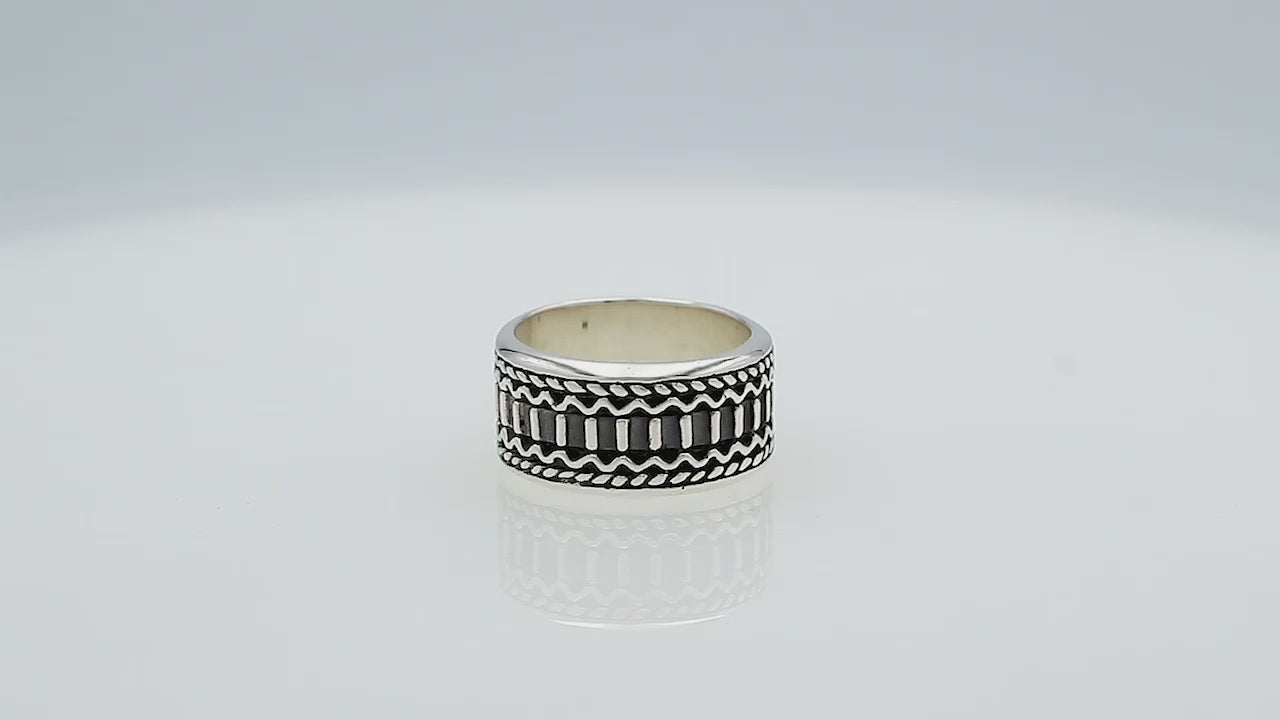 Wholesale sterling silver wide band ring with oxidized Bali-inspired carvings, handcrafted unisex artisan jewelry in bulk for retailers and resellers.
