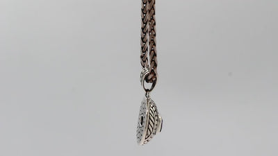 Sterling silver cushion pendant featuring Amethyst Quartz with detailed dome carving and oxidized Balinese silverwork.