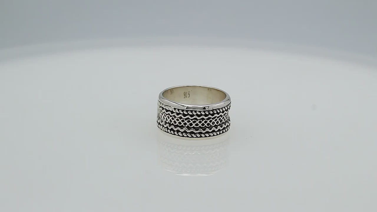 Wholesale sterling silver wide band ring with intricate tribal Bali design, handcrafted in 925 silver with oxidized detailing for jewelry retailers and bulk buyers.