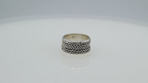 Wholesale sterling silver wide band ring with intricate tribal Bali design, handcrafted in 925 silver with oxidized detailing for jewelry retailers and bulk buyers.
