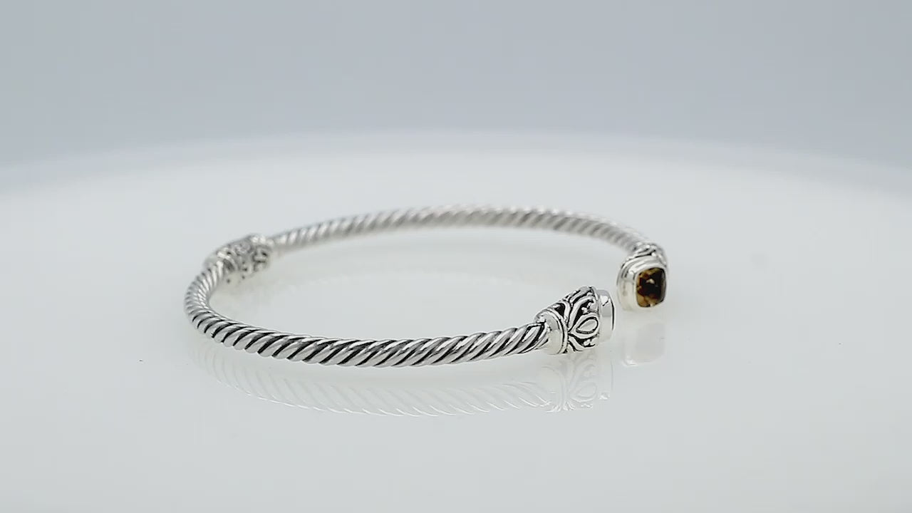 Silver twisted cable bangle in 925 sterling silver with Amethyst Quartz ends and Balinese engraving.