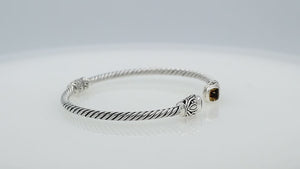 Silver twisted cable bangle in 925 sterling silver with Amethyst Quartz ends and Balinese engraving.