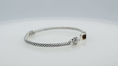 Silver twisted cable bangle in 925 sterling silver with Amethyst Quartz ends and Balinese engraving.