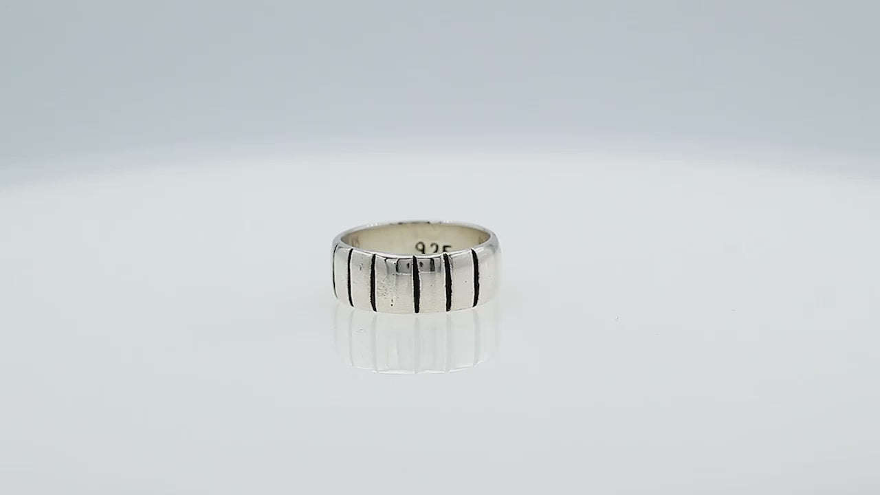 Wholesale sterling silver band ring with vertical oxidized stripe design, wide unisex 925 silver ring handcrafted in Bali for bulk orders and resellers.