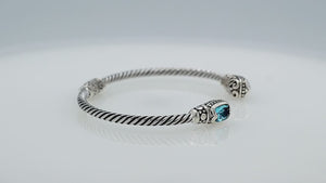 Silver twisted cable bangle in 925 sterling silver with Blue Topaz Quartz and ornate Balinese engraving.