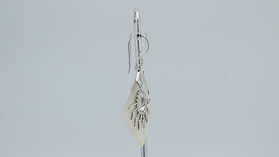 Sterling silver tribal earrings with Mother Of Pearl diamond panels and silver sunburst accents.