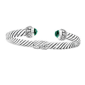 Handcrafted sterling silver cable cuff bracelet with green quartz and Balinese scroll details, elegant artisan jewelry for everyday wear.