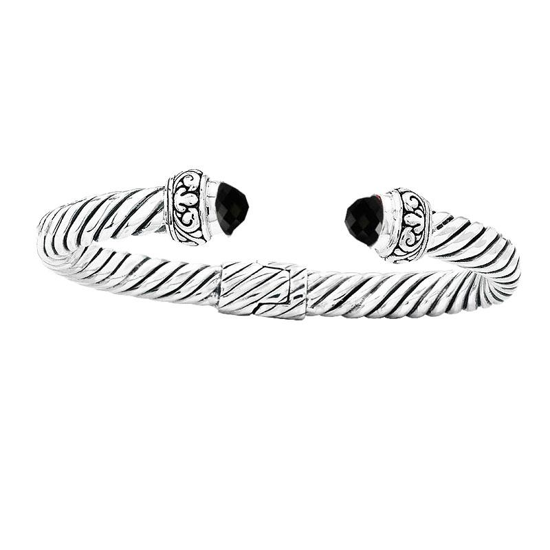Sterling silver twisted cable cuff bracelet with faceted black onyx, handcrafted in Bali for wholesale jewelry buyers.