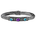 Sterling silver woven bracelet with blue and purple quartz gemstones, handcrafted in Bali.