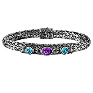 Sterling silver woven bracelet with blue and purple quartz gemstones, handcrafted in Bali.