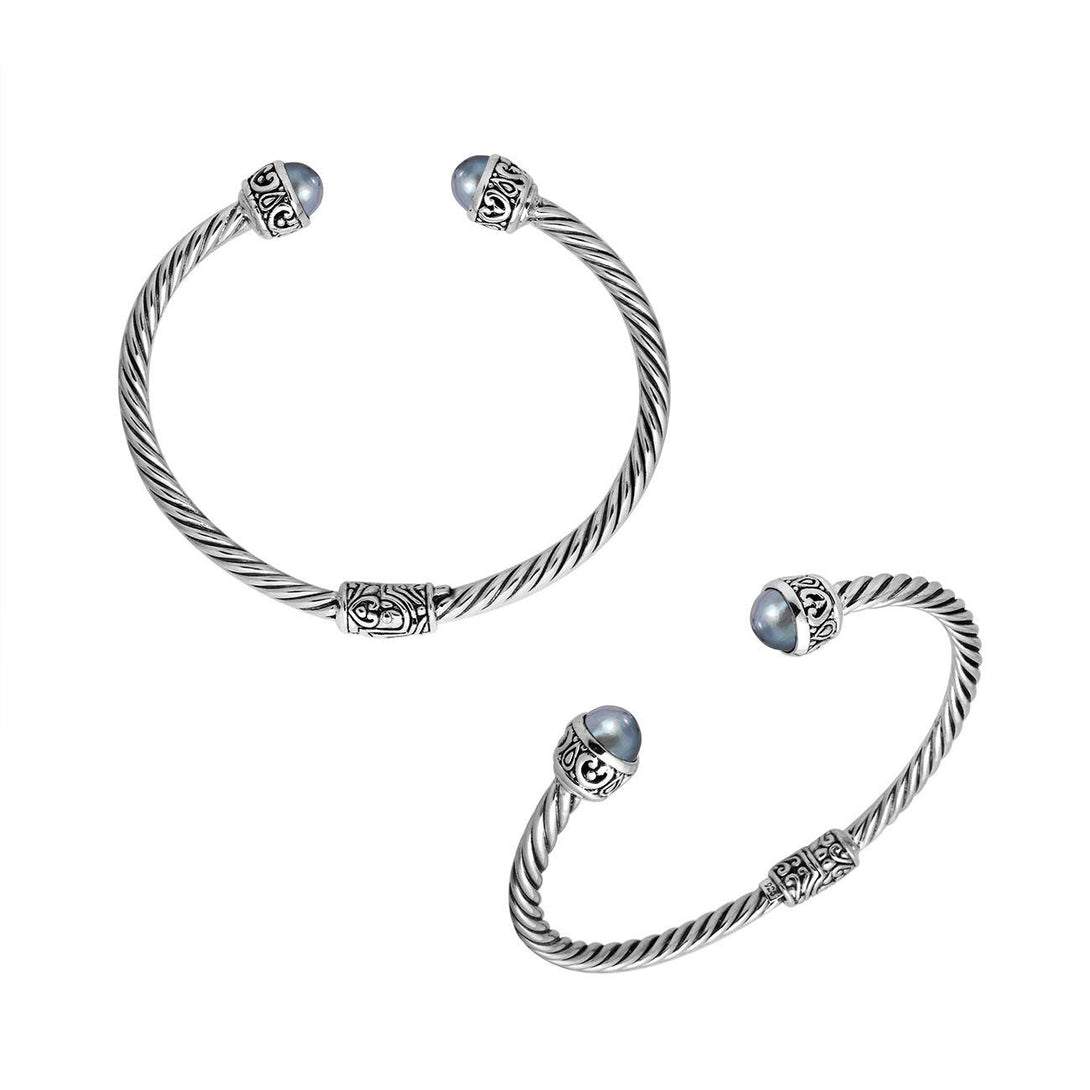 Wholesale sterling silver Gray Pearl bangle with twisted rope design, Balinese motifs, and oxidized finish, handcrafted in Bali.