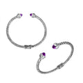 Sterling silver wholesale bangle with twisted rope design, featuring Amethyst Quartz and Cubic Zirconia end caps with Balinese motifs.