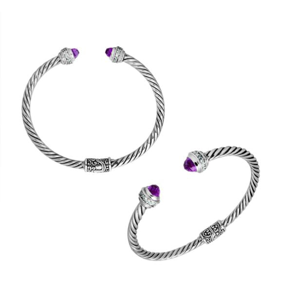 Sterling silver wholesale bangle with twisted rope design, featuring Amethyst Quartz and Cubic Zirconia end caps with Balinese motifs.