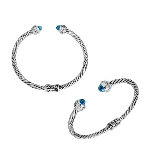 Sterling silver wholesale bangle with twisted rope design, Blue Topaz Quartz and Cubic Zirconia accents, handcrafted Balinese details.