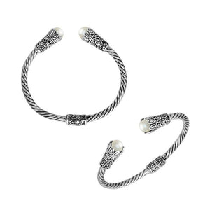 Sterling silver twisted bangle with pearl ends and Balinese carvings, handcrafted in Bali