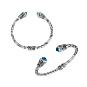 Sterling silver twisted bangle with Blue Topaz quartz ends and Balinese carvings, handcrafted in Bali