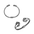 Sterling silver twisted bangle with cubic zirconia ends and Balinese carvings, handcrafted in Bali