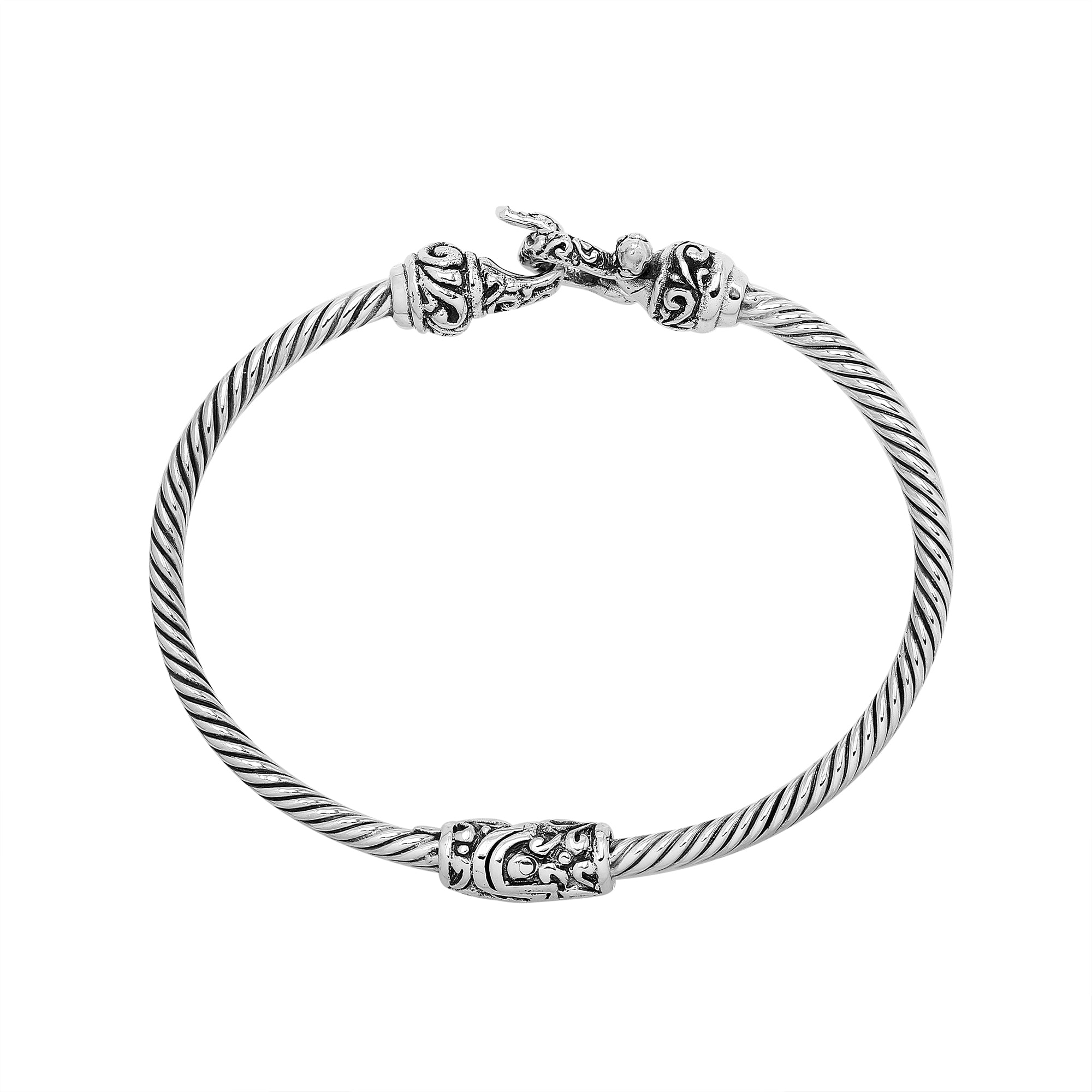 Sterling silver twisted bangle with Balinese detailing and hook clasp handcrafted in Bali.