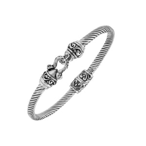 Sterling silver twisted bangle with Balinese detailing and hook clasp handcrafted in Bali.
