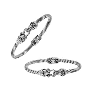 Sterling silver twisted bangle with Balinese detailing and hook clasp handcrafted in Bali.