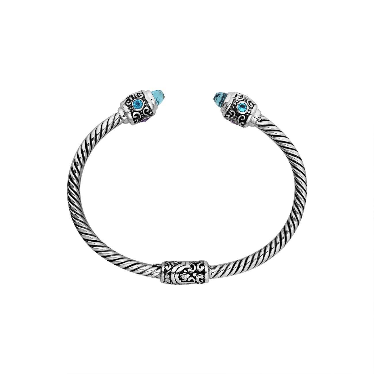 Sterling silver twisted bangle with Amethyst Quartz and Blue Topaz Quartz handcrafted in Bali.