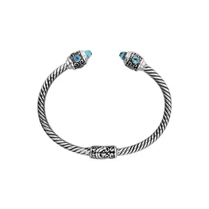 Sterling silver twisted bangle with Amethyst Quartz and Blue Topaz Quartz handcrafted in Bali.