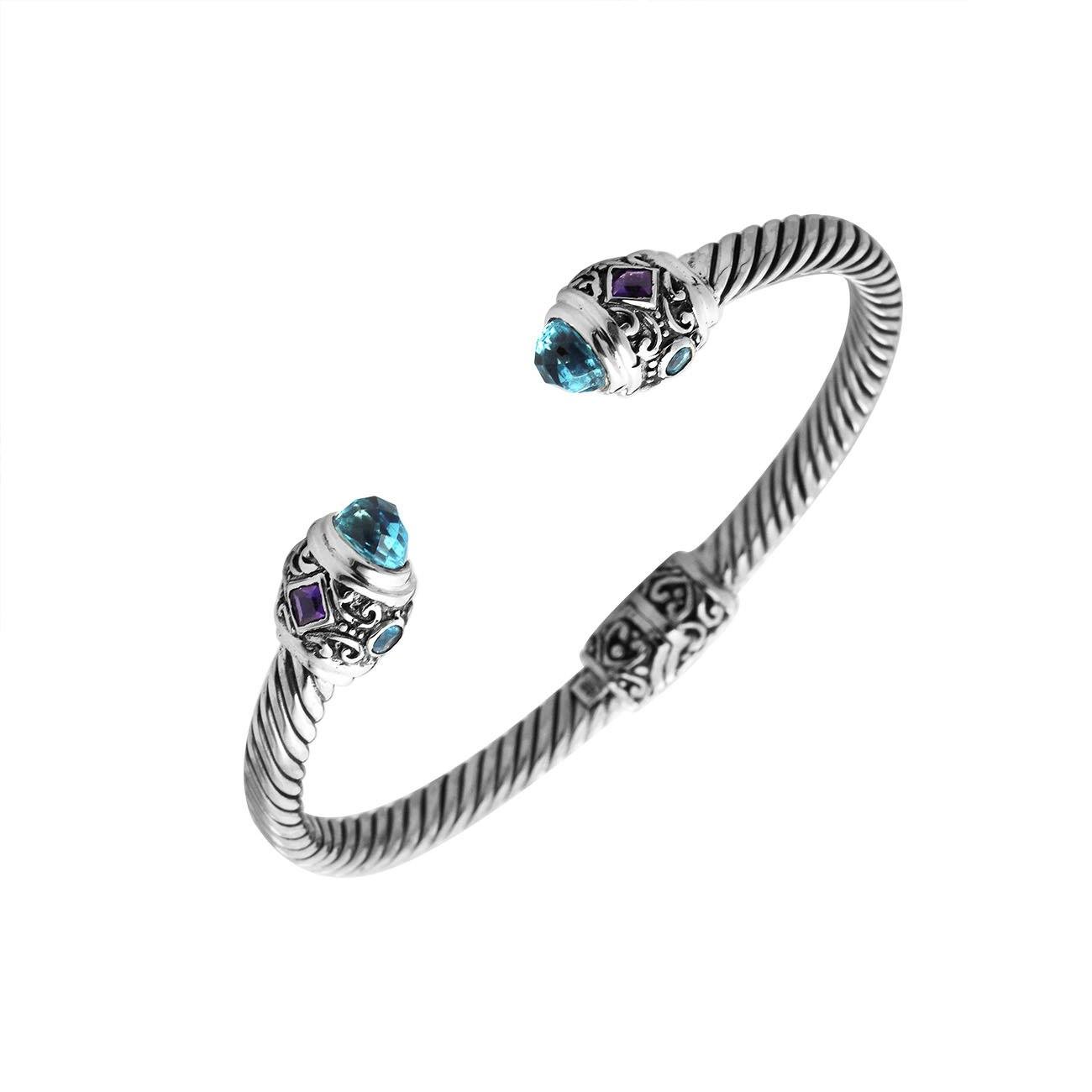 Sterling silver twisted bangle with Amethyst Quartz and Blue Topaz Quartz handcrafted in Bali.