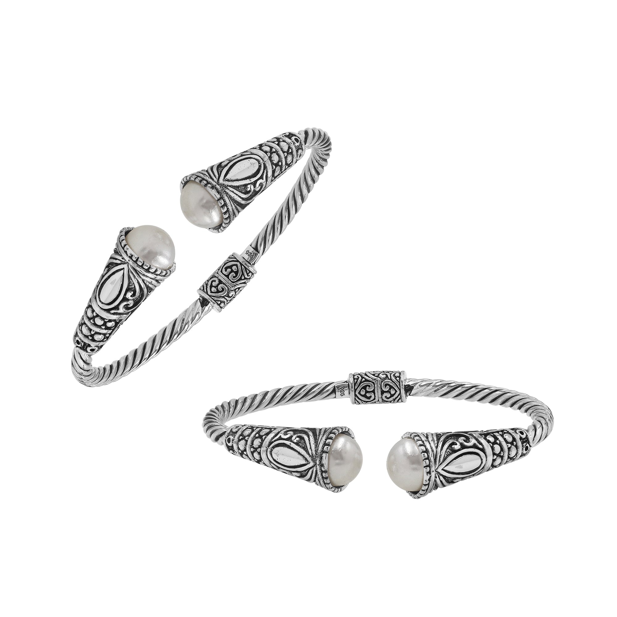 Sterling silver twisted bangle with pearl ends and oxidized Balinese design